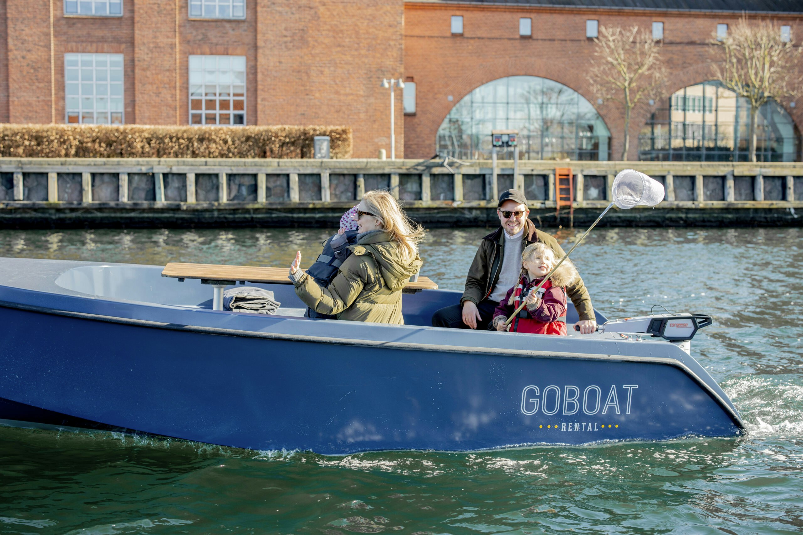Family enjoying Copenhagen in a boat GoBoat