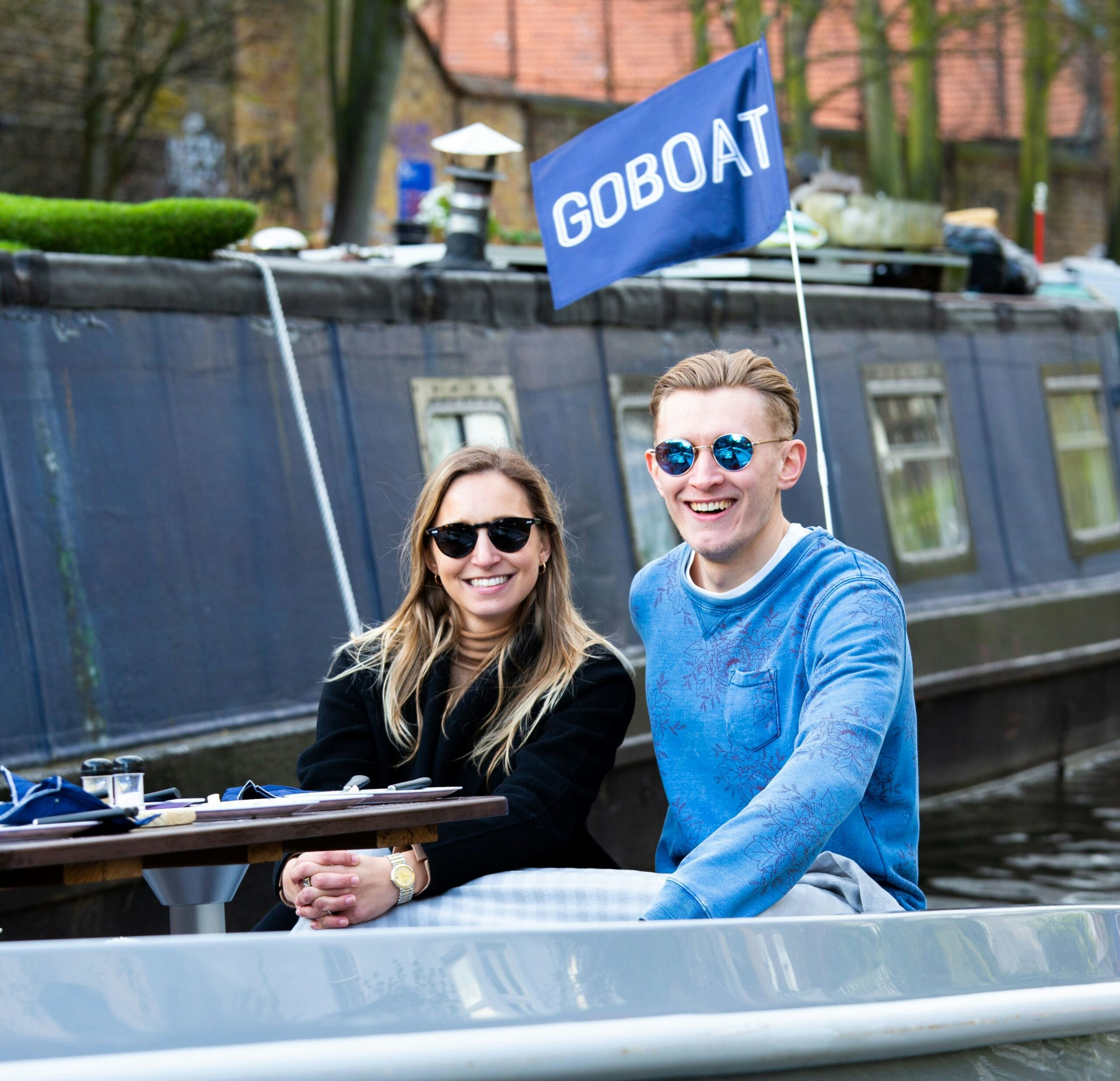 Couple on a GoBoat smiling in Paddington Basin canal trip